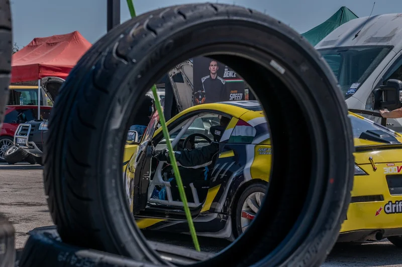 Hungarian drifter ready for race, with his poster in the background